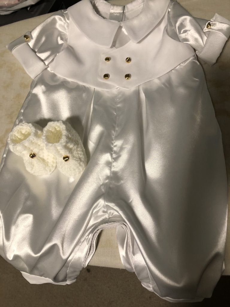 Example of a handmade Christening outfit made from a mother's wedding dress.