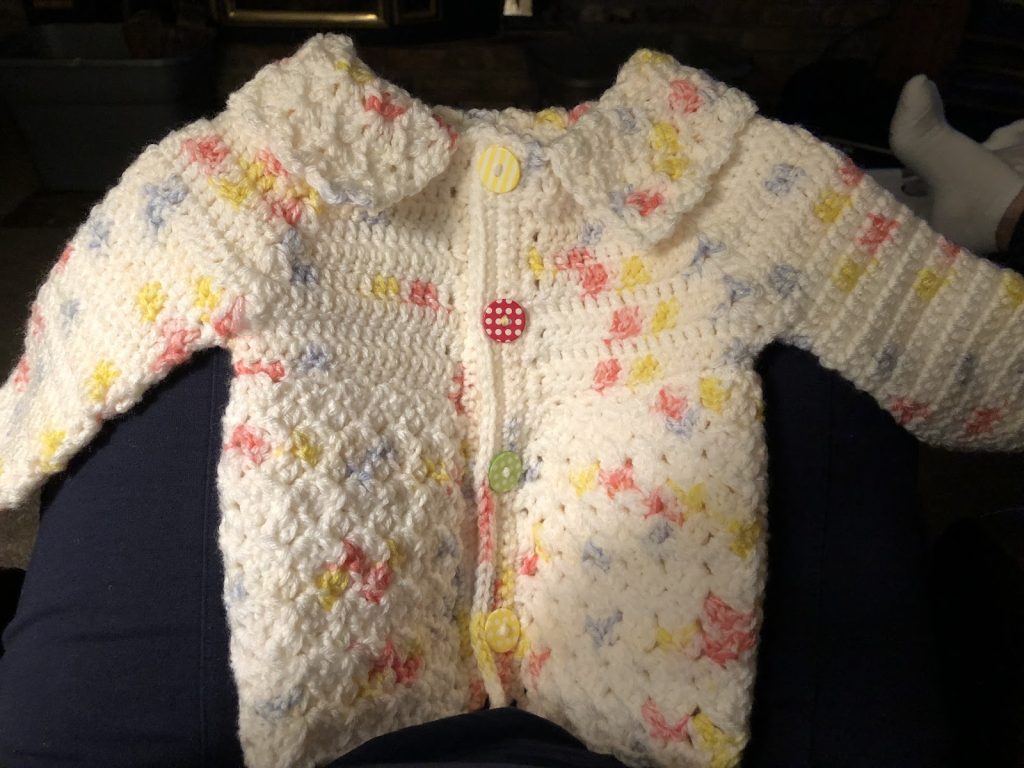 Example of a hand-crocheted sweater for a toddler.